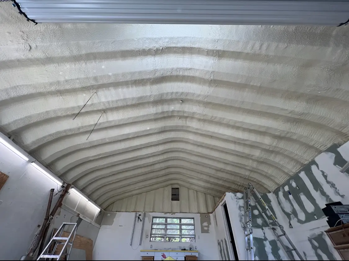 Spray polyurethane foam applied to the underside of a metal roof deck in Milwaukee
